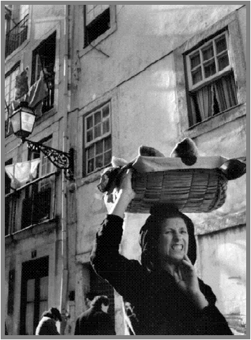 A varina, or fishmonger, traditionally carries her wares in a basket on her head. 